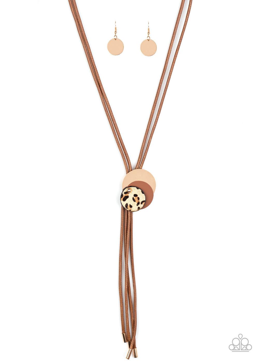 Paparazzi Accessories I’m FELINE Good - Brown .A trio of gold, brown, and fuzzy cheetah print discs overlap into an adjustable pendant along rows of shiny brown cording for a wildly retro look. Sold as one individual necklace. Includes one pair of matchin