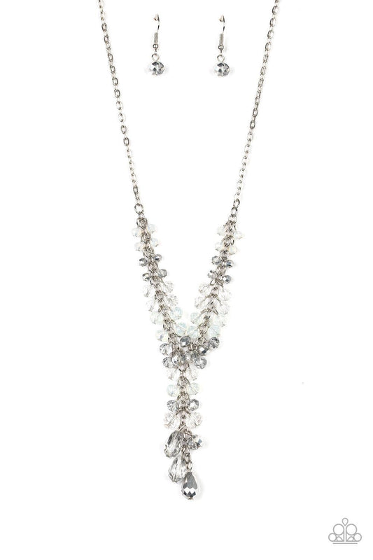 Paparazzi Accessories Iridescent Illumination - Silver A fringe of white, opaque, and metallic flecked crystal-like beads dangle from the bottom of a shimmery silver chain. Matching round and teardrop beads cascade from an extended silver chain at the cen