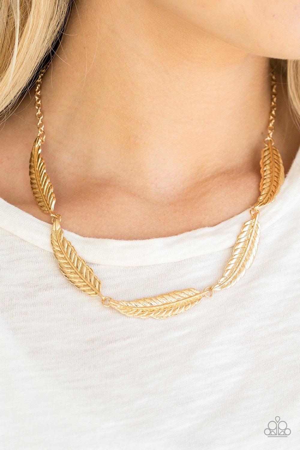 Paparazzi Accessories Light Flight - Gold Brushed in a high-sheen shimmer, lifelike gold feathers link below the collar in a seasonal fashion. Features an adjustable clasp closure. Sold as one individual necklace. Includes one pair of matching earrings. J