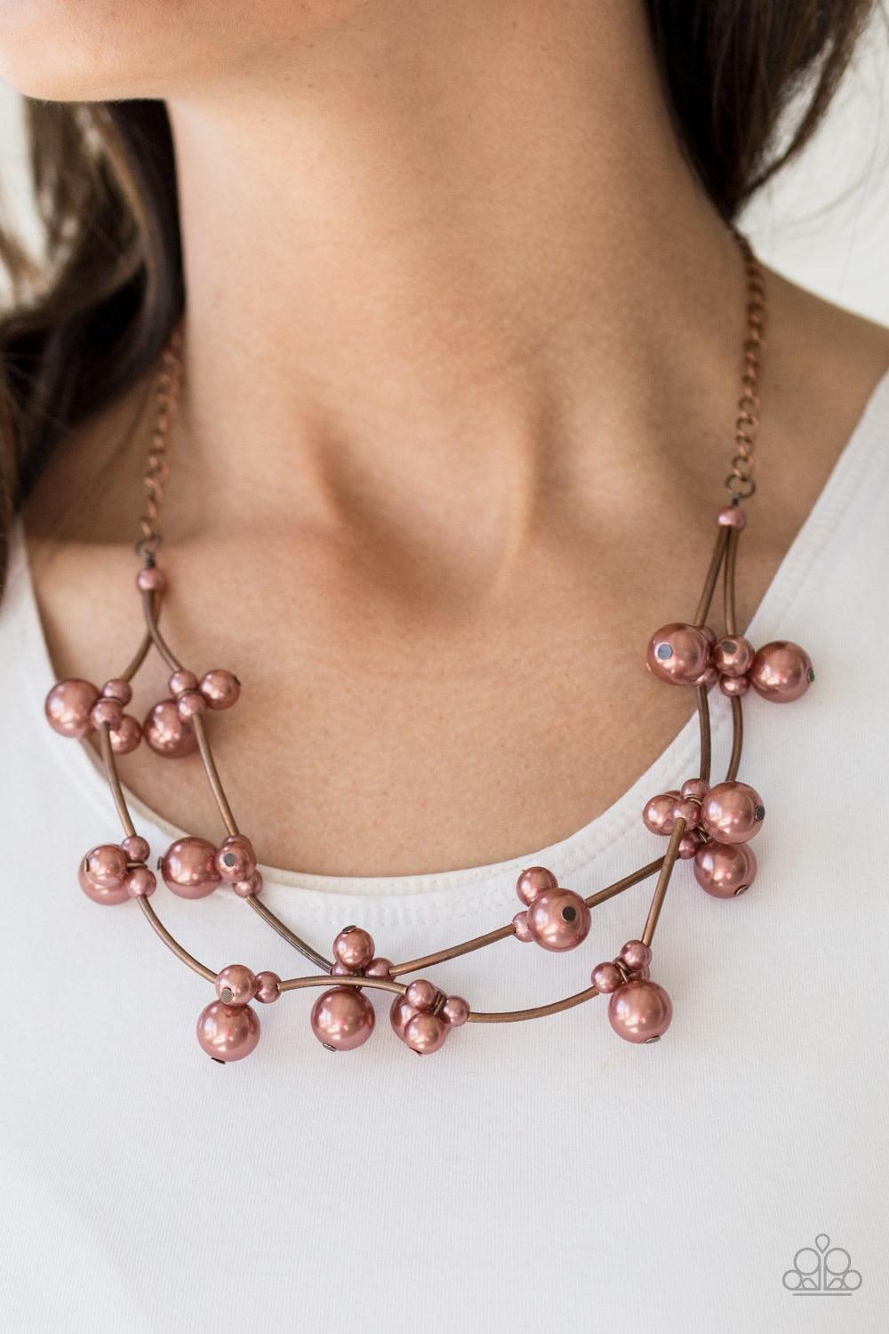 Paparazzi Accessories Wedding BELLES - Copper Cylindrical copper beads and clusters of pearly copper beads are threaded along invisible wires, creating bubbly layers below the collar for a refined look. Features an adjustable clasp closure. Jewelry