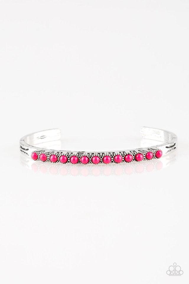 Paparazzi Accessories New Age Traveler - Pink Dainty pink beads are encrusted along the center of a dainty silver cuff stamped in tribal inspired patterns for a seasonal look. Jewelry