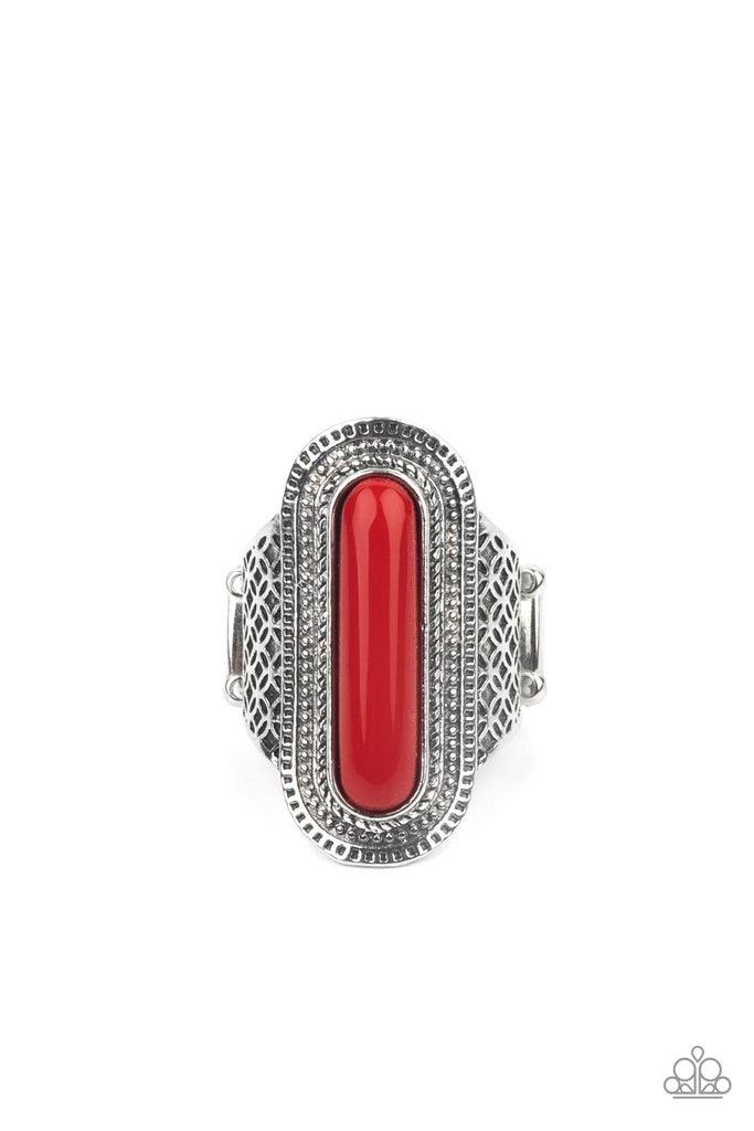 Paparazzi Accessories Dubai Distraction - Red An oblong red bead adorns the center of an oval silver frame studded and stamped in tactile texture. The radiant frame attaches to a silver band embossed in antiqued floral-like details, creating a colorful ce