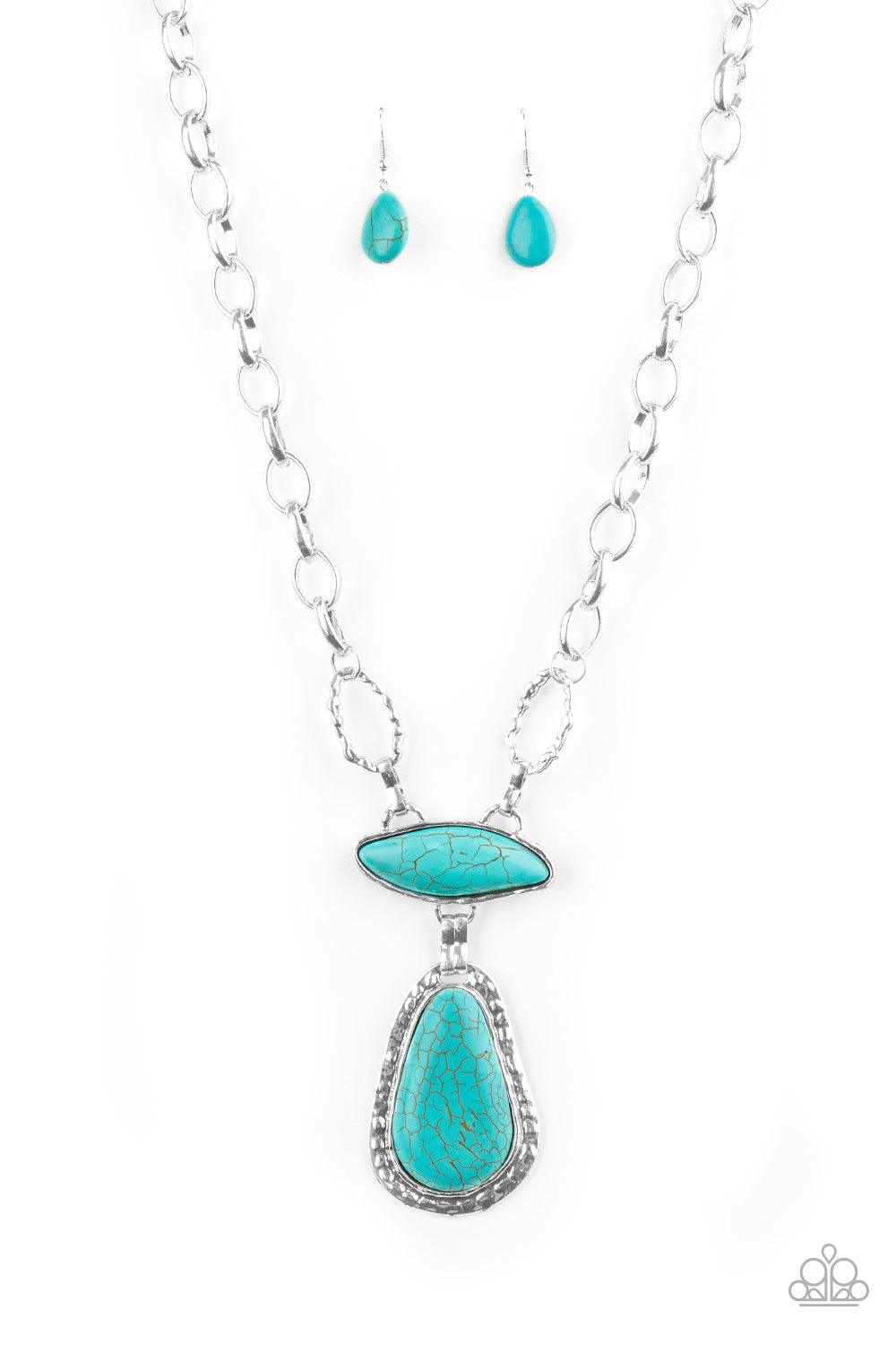 Paparazzi Accessories Rural Rapture - Blue Linked by handcrafted fittings, a pair of imperfect turquoise stones are pressed into asymmetrical hammered silver frames as they stack below the collar. Oversized silver links and a pair of hammered links form i