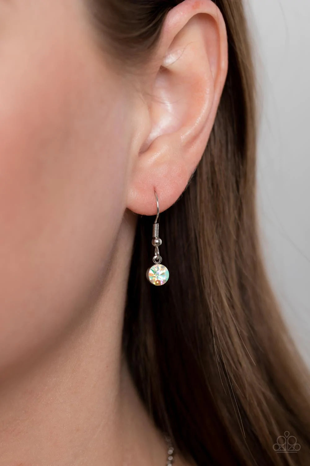 Paparazzi Accessories Irresistible HEIR-idescene - Pink Varying in geometric shapes and shades of pink, glittery rose and fuchsia gems are sprinkled between iridescent rhinestone accents for a dreamy refined, and irresistible finish. Features an adjustabl