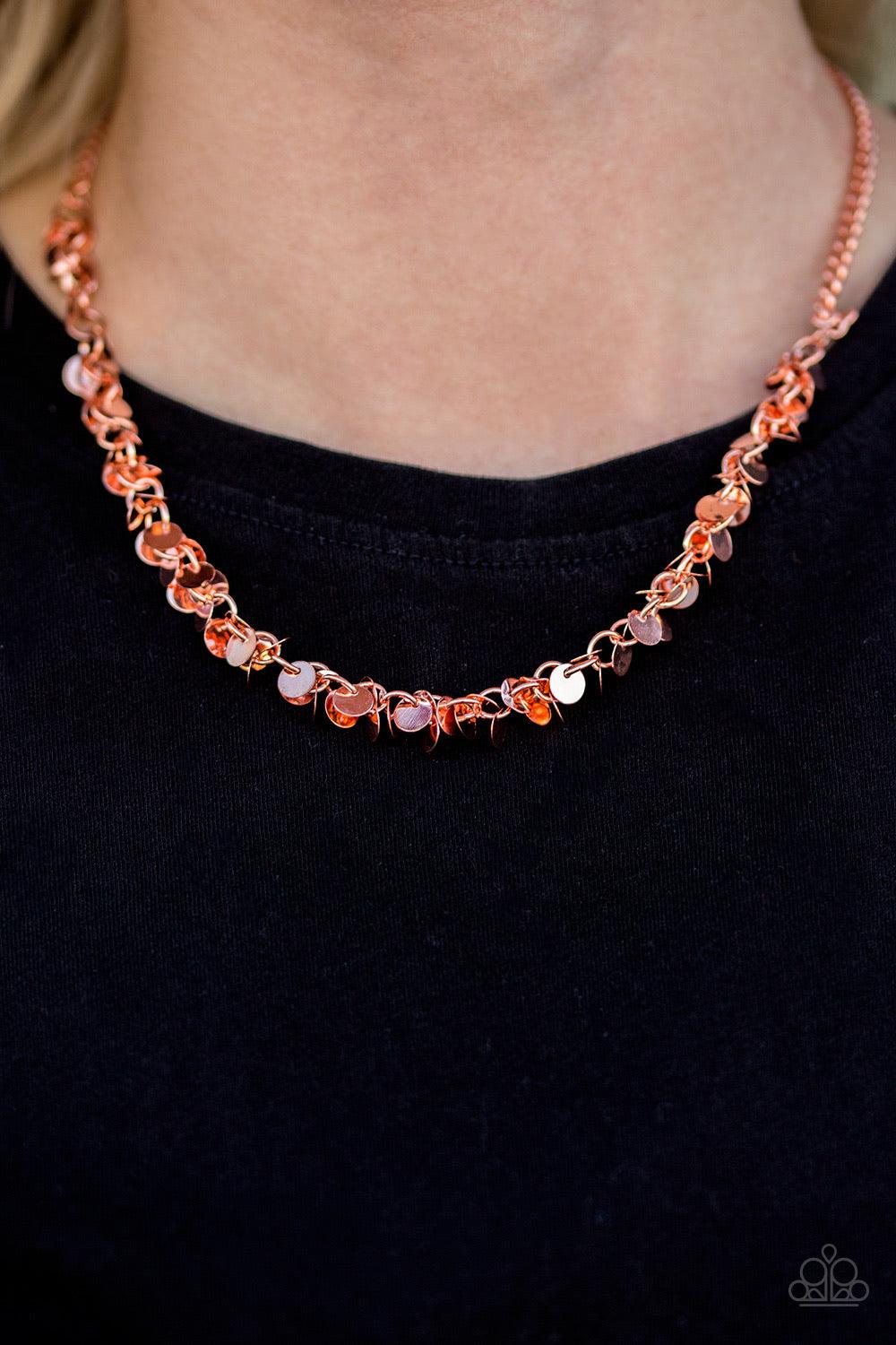 Paparazzi Accessories Year To Shimmer ~Copper Dainty shiny copper discs trickle below the collar, creating a flirty fringe. The flat shiny discs catch and reflect the light, creating playful movement across the chest. Features an adjustable clasp closure.