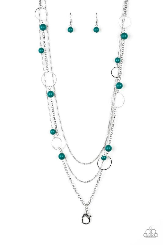 Paparazzi Accessories Beachside Babe - Green *Lanyard Featuring refreshing green beads and shimmery silver hoops, mismatched silver chains layer down the chest for a seasonal look. A lobster clasp hangs from the bottom of the design to allow a name badge