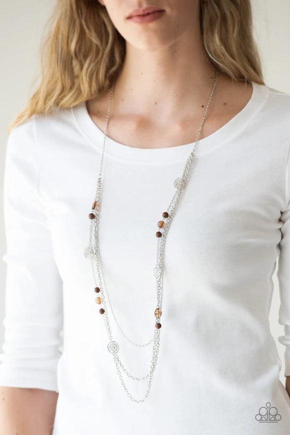 Paparazzi Accessories Pretty Pop-tastic! - Brown Ornate silver accents, glassy beads, and polished brown beads trickle along strands of shimmery silver chains for a whimsical look. Features an adjustable clasp closure. Sold as one individual necklace. Inc