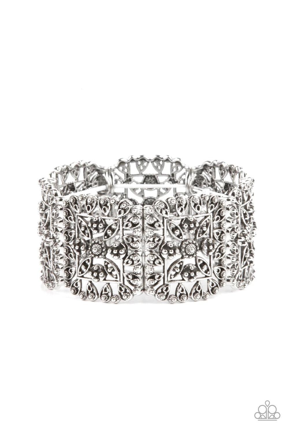 Paparazzi Accessories Enchanted Vineyard - Silver Ornately studded leafy filigree delicately gathers into airy silver square frames that are threaded along stretchy bands around the wrist, creating a vintage inspired look. Sold as one individual bracelet.