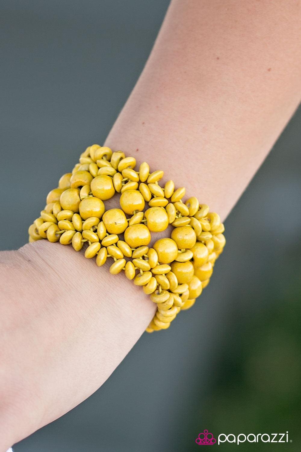 Paparazzi Accessories Tropical Bliss - Yellow Yellow wooden accents are threaded along elastic stretchy bands, creating an ornate bracelet. Rounded yellow wooden beads line the center of the summery pattern for a bold finish. Jewelry