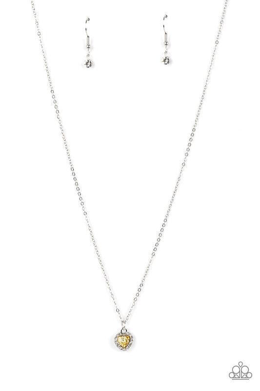 Paparazzi Accessories A Little Lovestruck - Yellow Bordered in glassy white rhinestones, a dainty yellow rhinestone heart sparkles along a dainty silver chain below the collar for a flirtatious fashion. Features an adjustable clasp closure. Sold as one in