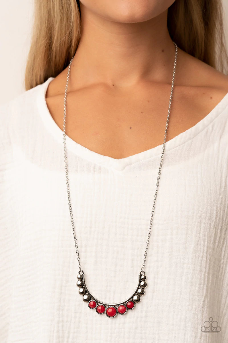 Paparazzi Accessories Horseshoe Bend - Red Flat silver beads fade into cloudy red stone beads as they bow into a half moon at the bottom of a curved silver bar, creating an ethereal pop of color at the bottom of an extended silver chain. Features an adjus