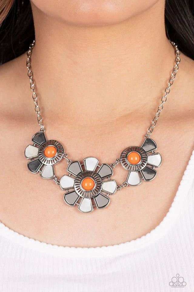 Paparazzi Accessories Aquatic Garden - Orange Dotted with orange bead centers, silver and white shell-like petals fan out from an airy metal frame. The trio of whimsically industrial flowers connects to a conventional silver chain below the collar resulti