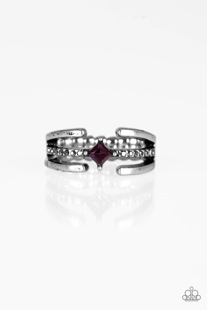 Paparazzi Accessories City Center - Purple Glistening silver bars gather around a sparkling hematite rhinestone encrusted band. Featuring a regal square cut, a purple rhinestone is pressed into the center for an edgy finish. Features a dainty stretchy ban