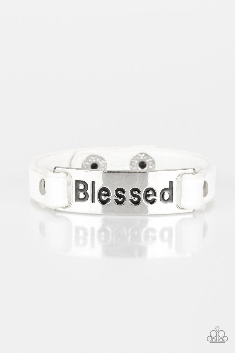 Paparazzi Accessories Count Your Blessings - White Stamped in the word, "Blessed", a shiny silver plate is studded in place along a dainty white leather band for a whimsical look. Features an adjustable snap closure. Jewelry