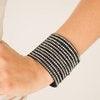 Paparazzi Accessories The Boss Is Back ~Black A thick black suede band is spliced into various strands. Glassy hematite rhinestones are sprinkled across the strands, creating blinding shimmer around the wrist for a knockout look. Features an adjustable sn