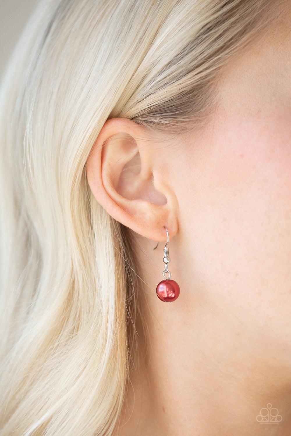 Paparazzi Accessories Fiercely Fancy - Red Featuring pearly and glassy finishes, an array of silver and red beads swing from a double-linked silver chain, creating a fancy fringe below the collar. Features an adjustable clasp closure. Sold as one individu