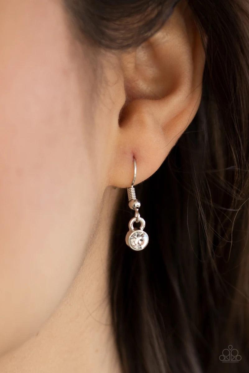 Paparazzi Accessories Treasures of the Heart - Pink Bordered in dainty white rhinestones, an airy silver locket inspired pendant is dotted with a pink heart-shaped rhinestone as it flirtatiously glides along a dainty silver chain below the collar. Feature