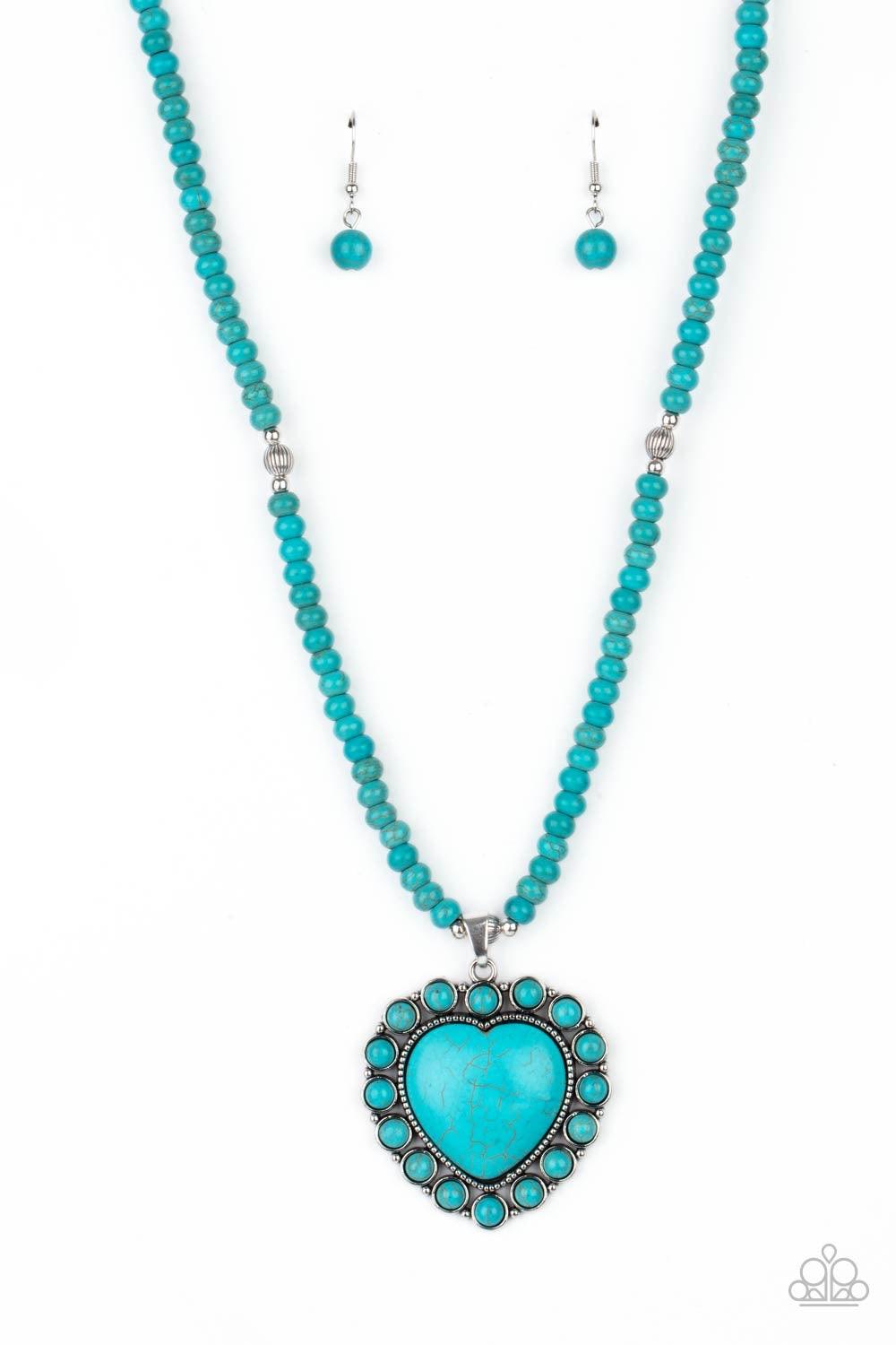 Paparazzi Accessories A Heart of Stone - Blue Bordered by dainty turquoise stones, an oversized turquoise stone heart pendant swings from the bottom of a turquoise stone and silver beaded display below the collar for a flirtatiously earthy fashion. Featur