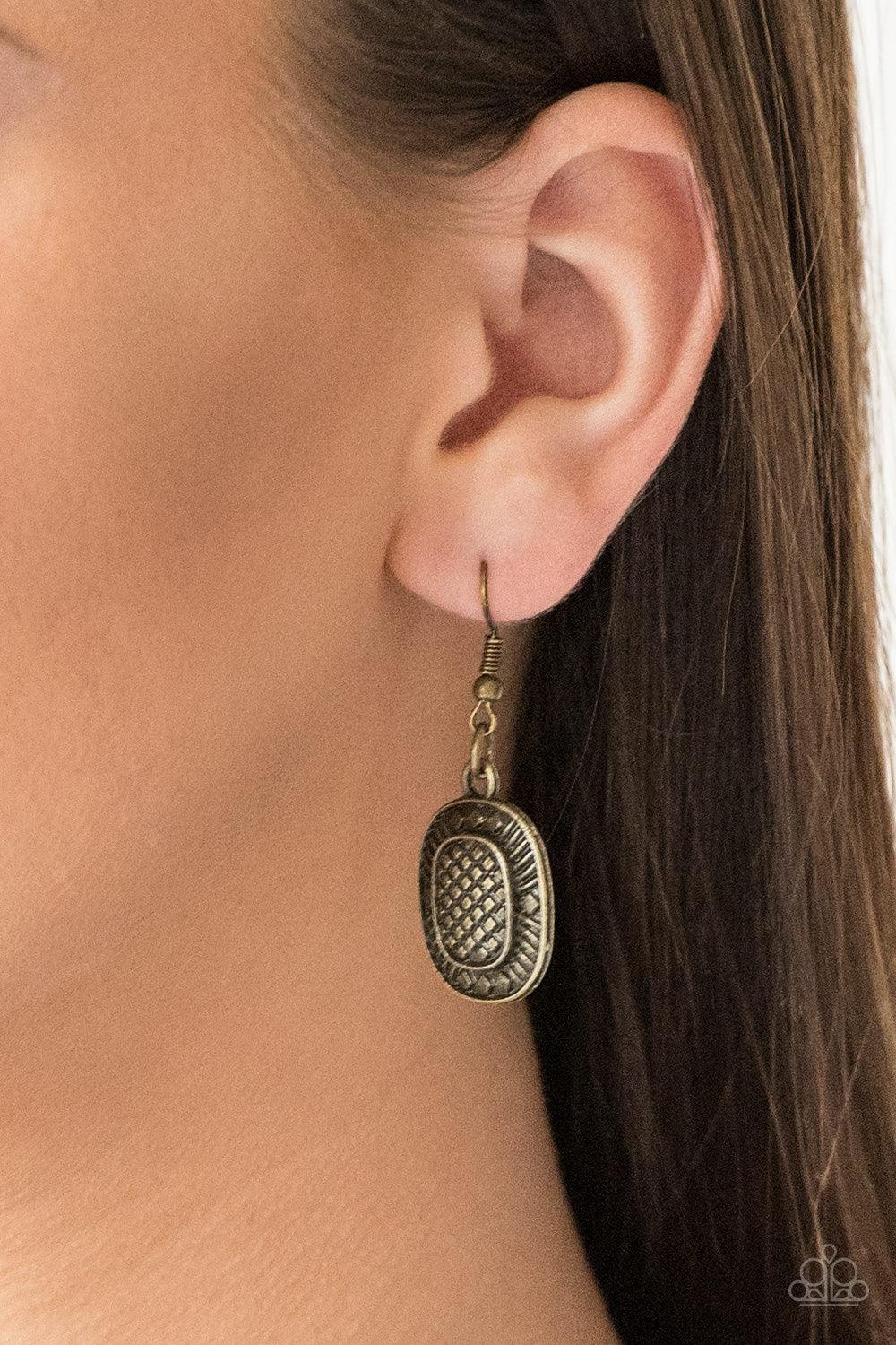Paparazzi Accessories Prehistoric Powerhouse - Brass Radiating with geometric and linear details, ornate brass plates link below the collar for a bold tribal look. Features an adjustable clasp closure. Sold as one individual necklace. Includes one pair of