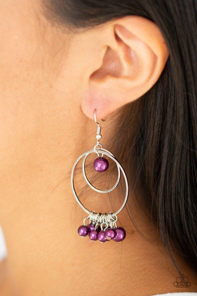Paparazzi Accessories New York Attraction - Purple Infused with a bubbly purple pearl fringe, a double hoop frame swings from the ear. A solitaire pearl swings from the top of the joined hoops for a refined finish. Earring attaches to a standard fishhook