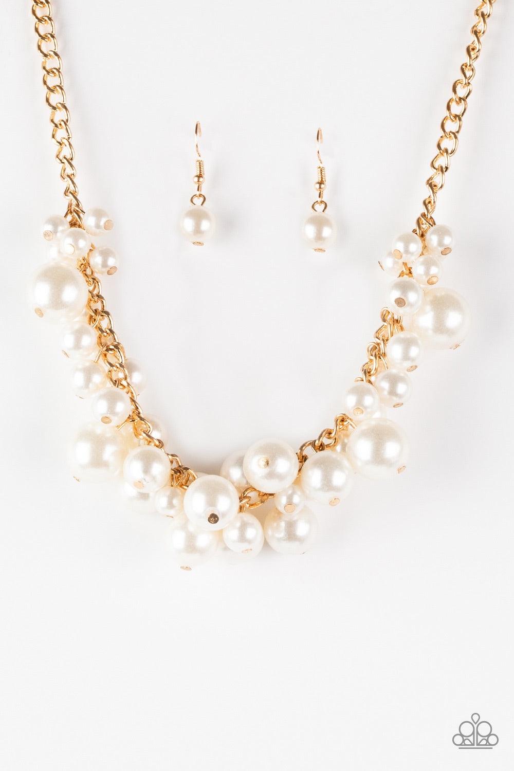 Paparazzi Accessories Glam Queen - Gold Varying in size, bubbly white pearls cascade from the bottom of a bold gold chain, creating a dramatically clustered fringe below the collar. Features an adjustable clasp closure. Jewelry