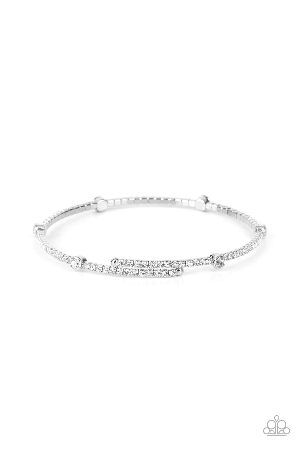 Paparazzi Accessories Upgraded Glamour - White Encased in shiny silver fittings, a sparkly collection of solitaire white rhinestones adorn a glittery strand of dainty white rhinestones that coil around the wrist, creating a dainty cuff. Sold as one indivi