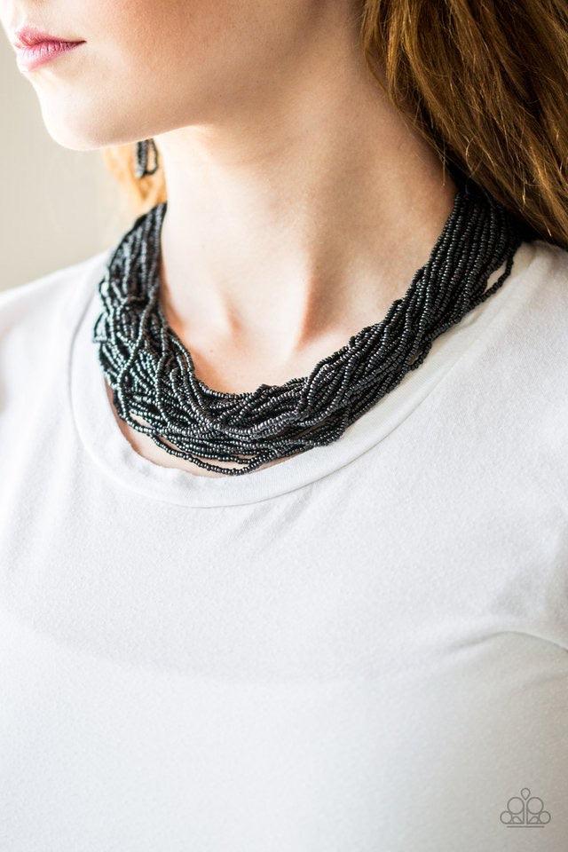 Paparazzi Accessories The Show Must CONGO On! - Black Infused with two bold silver fittings, countless strands of black seed beads drape below the collar for a seasonal look. Features an adjustable clasp closure. Sold as one individual necklace. Includes