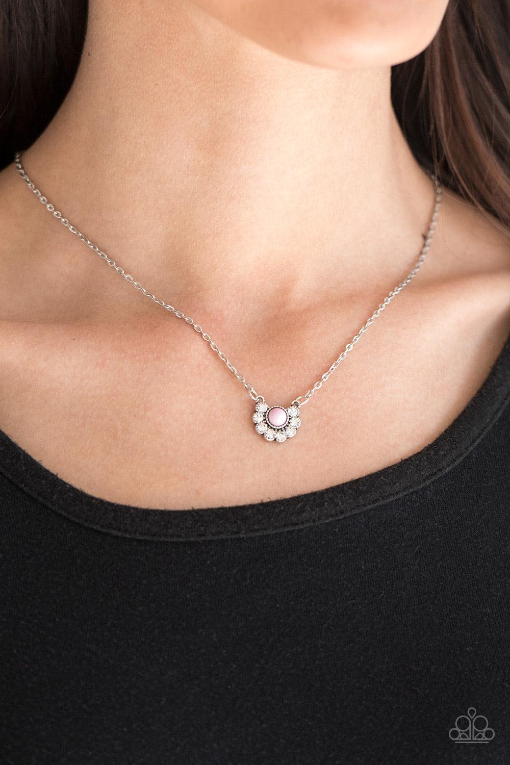 Paparazzi Accessories Pampered Princess - Pink Dainty white rhinestones are encrusted along the bottom of a dainty pink bead, creating a glamorous pendant below the collar. Features an adjustable clasp closure. Sold as one individual necklace. Includes on