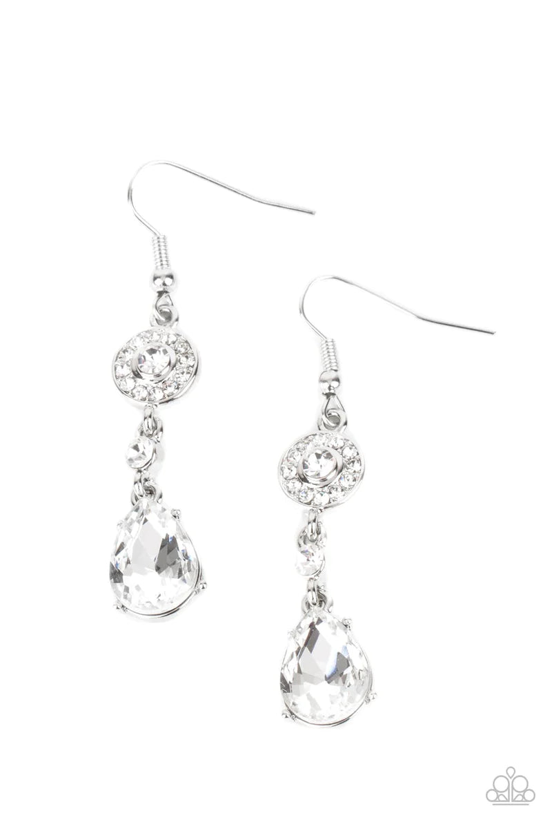 Paparazzi Accessories Graceful Glimmer - White A silver frame dotted in glassy white rhinestones, a solitaire white rhinestone, and an oversized white teardrop gem delicately link into a graceful lure. Earring attaches to a standard fishhook fitting. Sold