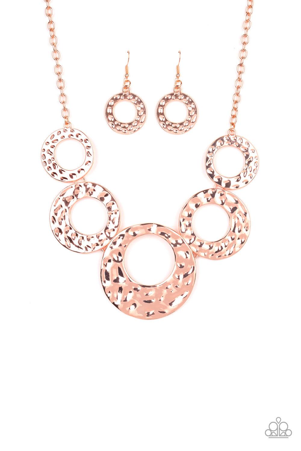 Paparazzi Accessories Mildly Metro - Copper Gradually increasing in size, hammered shiny copper circles link below the collar for a statement-making look. Features an adjustable clasp closure Jewelry