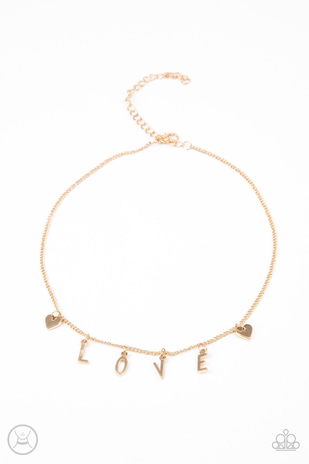 Paparazzi Accessories Love Conquers All - Gold Nestled between a pair of dainty gold hearts, dangling gold letter charms spell out the word, "LOVE," creating a flirty fringe around the neck. Features an adjustable clasp closure. Sold as one individual cho