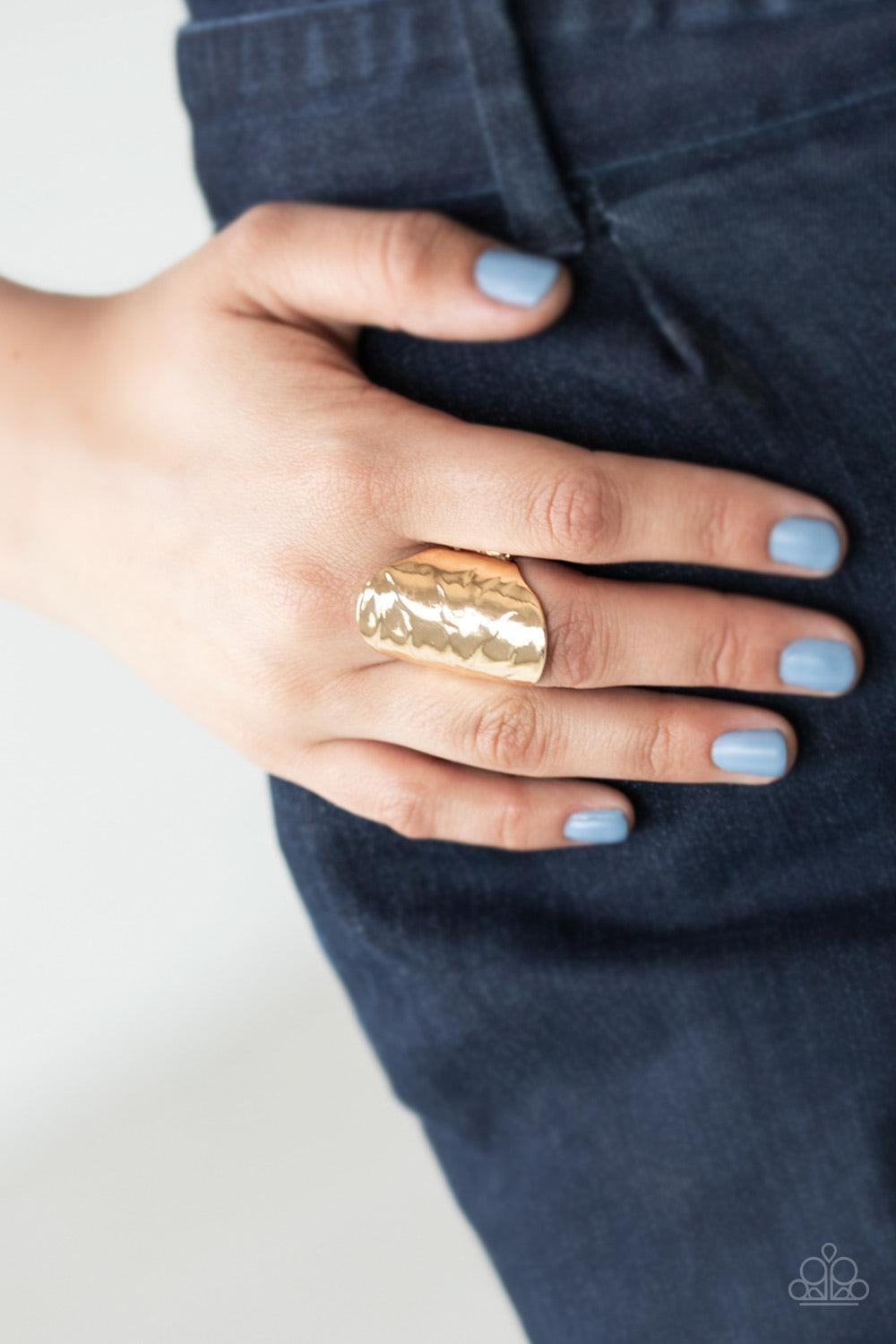 Paparazzi Accessories Retro Ripple - Gold Wavy texture is embossed across the front of a thick gold frame, creating a retro inspired centerpiece. Features a stretchy band for a flexible fit. Sold as one individual ring. Jewelry