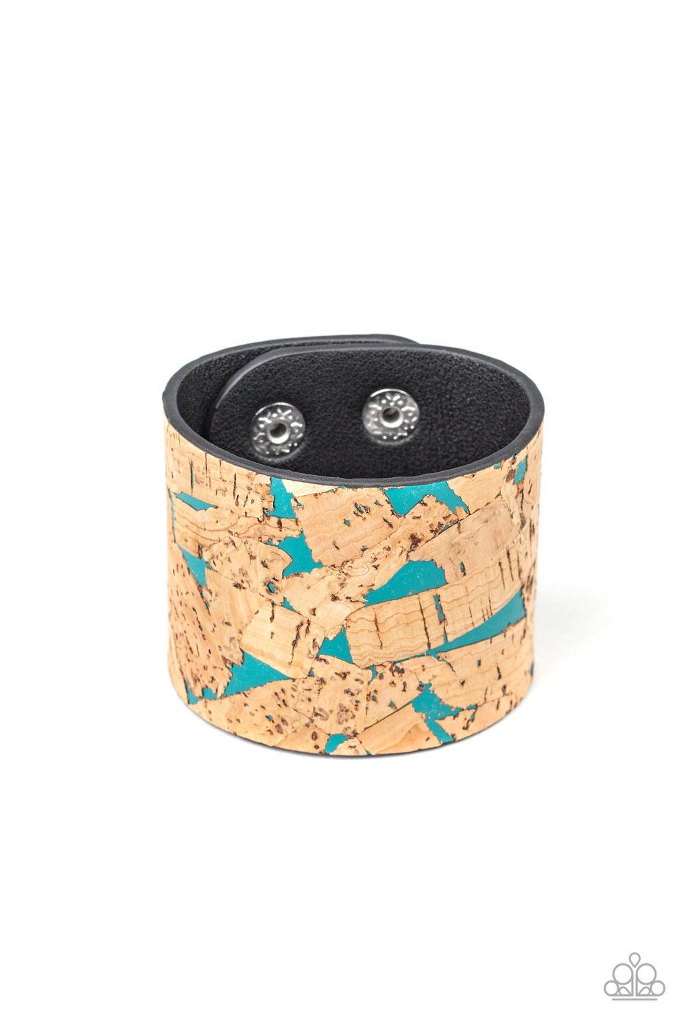 Paparazzi Accessories Cork Congo - Blue Pieces of cork have been plastered across the front of a blue leather band, creating an earthy look around the wrist. Features an adjustable snap closure. Jewelry