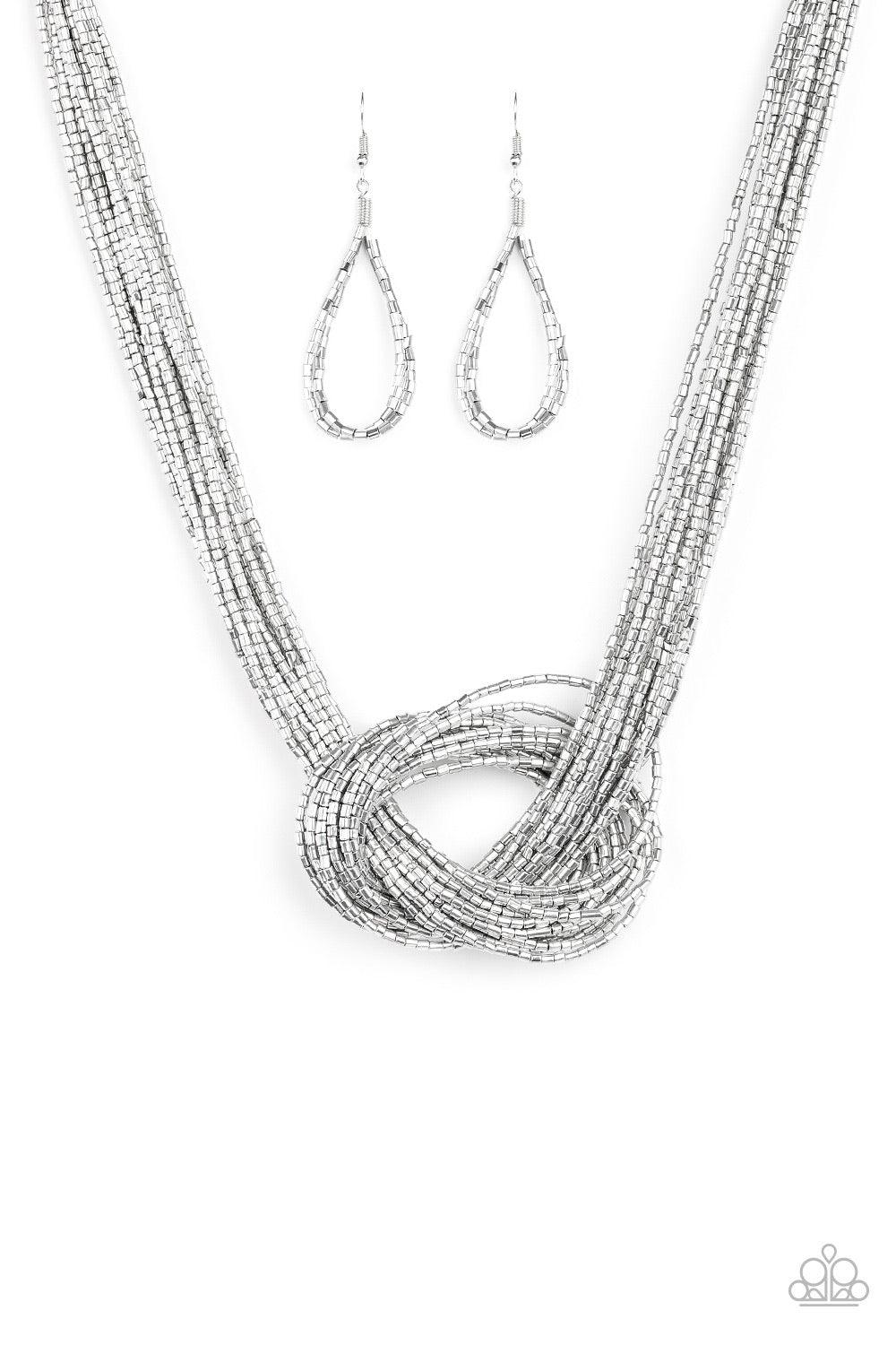 Paparazzi Accessories Knotted Knockout - Silver Countless strands of silver seed beads delicately knot together below the collar to create an unforgettable statement piece. Features an adjustable clasp closure. Jewelry