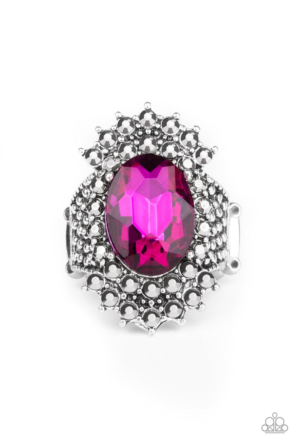 Paparazzi Accessories Him and HEIR - Pink Glittery hematite rhinestones flare out from a dramatically oversized pink rhinestone center. The regal frame sits atop a silver studded band for a statement-making finish. Features a stretchy band for a flexible