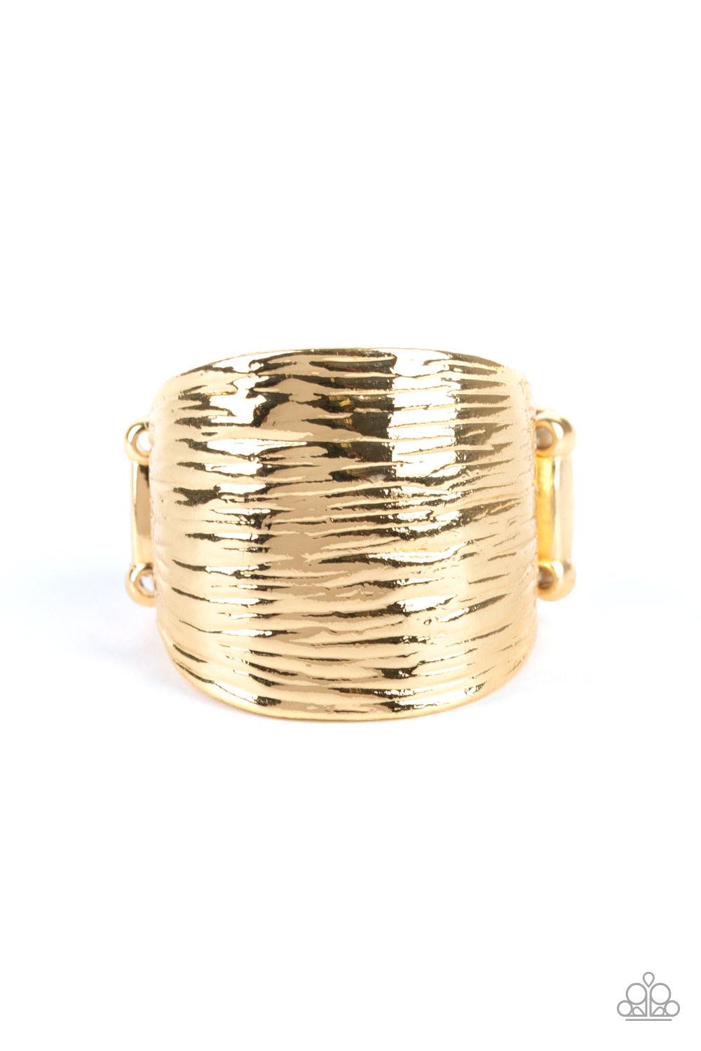 Paparazzi Accessories Rippling Rivers ~Gold Rippling with linear textures, a thick gold frame curls around the finger for a casual look. Features a stretchy band for a flexible fit.
