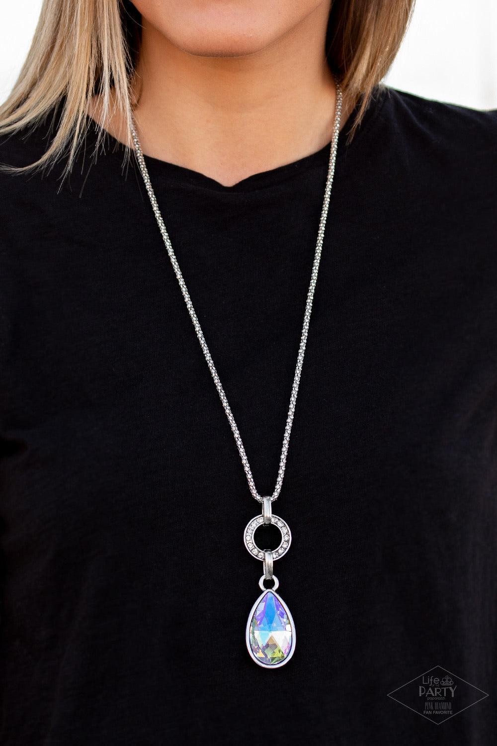 Paparazzi Accessories Lookin’ Like A Million - Multi Encrusted in glittery white rhinestones, a shimmery silver ring gives way to a dramatic iridescent gem teardrop. The impressive pendant slides along a shimmery silver popcorn chain for a refined look. F
