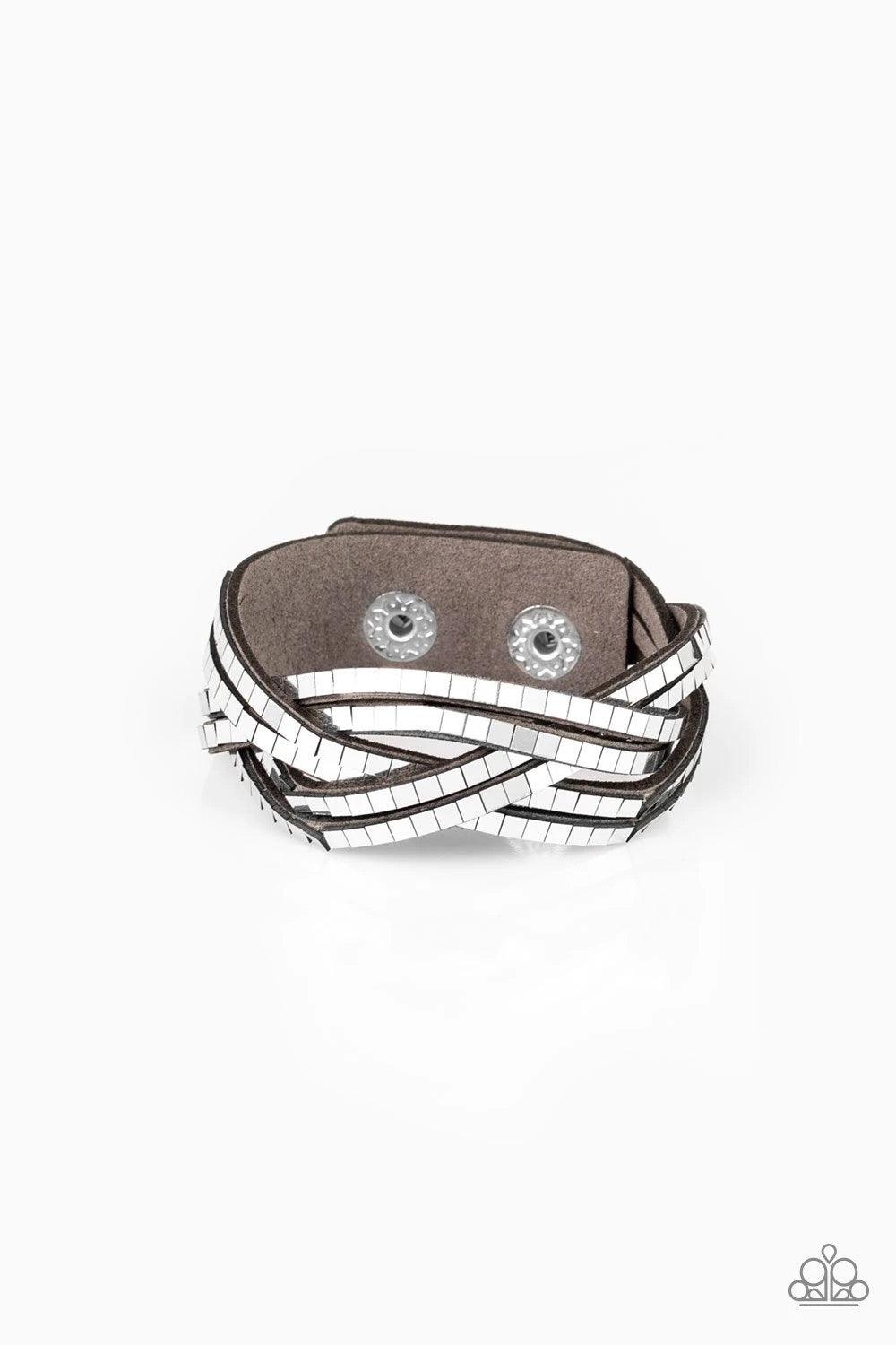 Paparazzi Accessories Looking For Trouble - Silver Flat silver cubes are encrusted along rows of braided gray suede for an edgy look. Features an adjustable snap closure. Sold as one individual bracelet. Jewelry