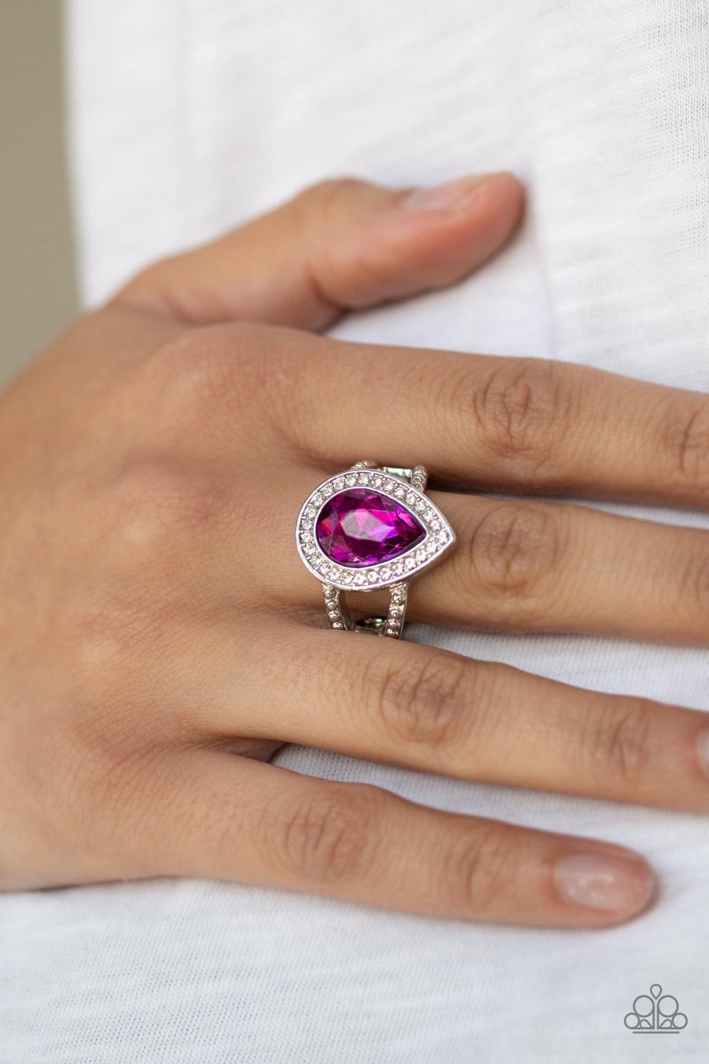 Paparazzi Accessories Hollywood Heirloom - Pink A glassy pink teardrop gem is pressed into a glistening silver frame encrusted in dainty white rhinestones, creating a glamorous frame atop the finger. Features a dainty stretchy band for a flexible fit. Jew