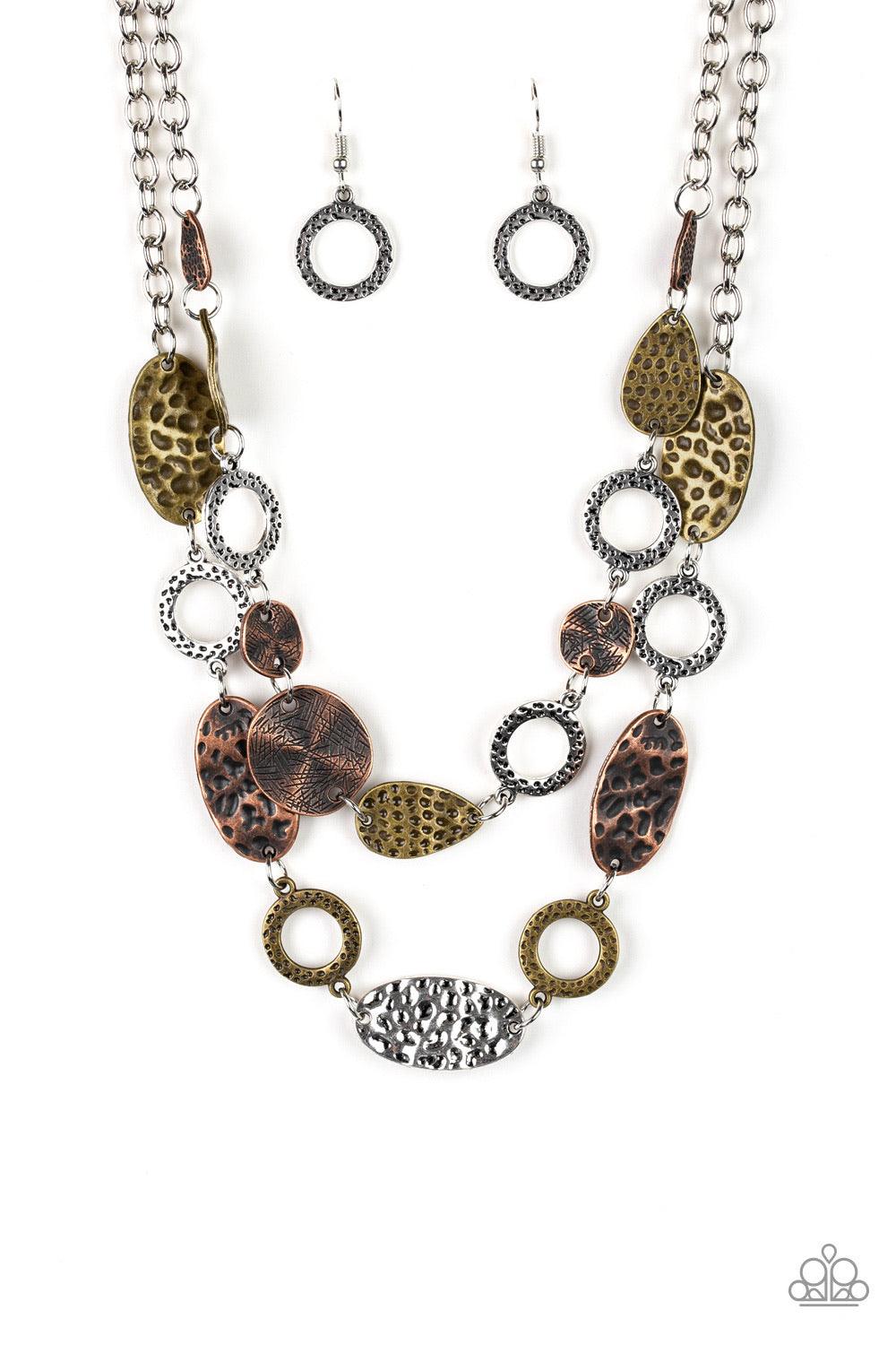 Paparazzi Accessories Trippin On Treasure ~Multi Delicately hammered in shimmery textures, mismatched brass, copper, and silver frames link below the collar in two seasonal layers. Features an adjustable clasp closure. Sold as one individual necklace. Inc