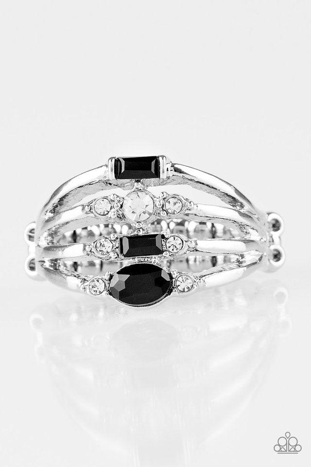 Paparazzi Accessories Not So Novice - Black Featuring round, oval, and emerald style cuts, dainty black and white rhinestones are sprinkled along dainty silver bands, coalescing into a refined frame. Features a dainty stretchy band for a flexible fit. Jew