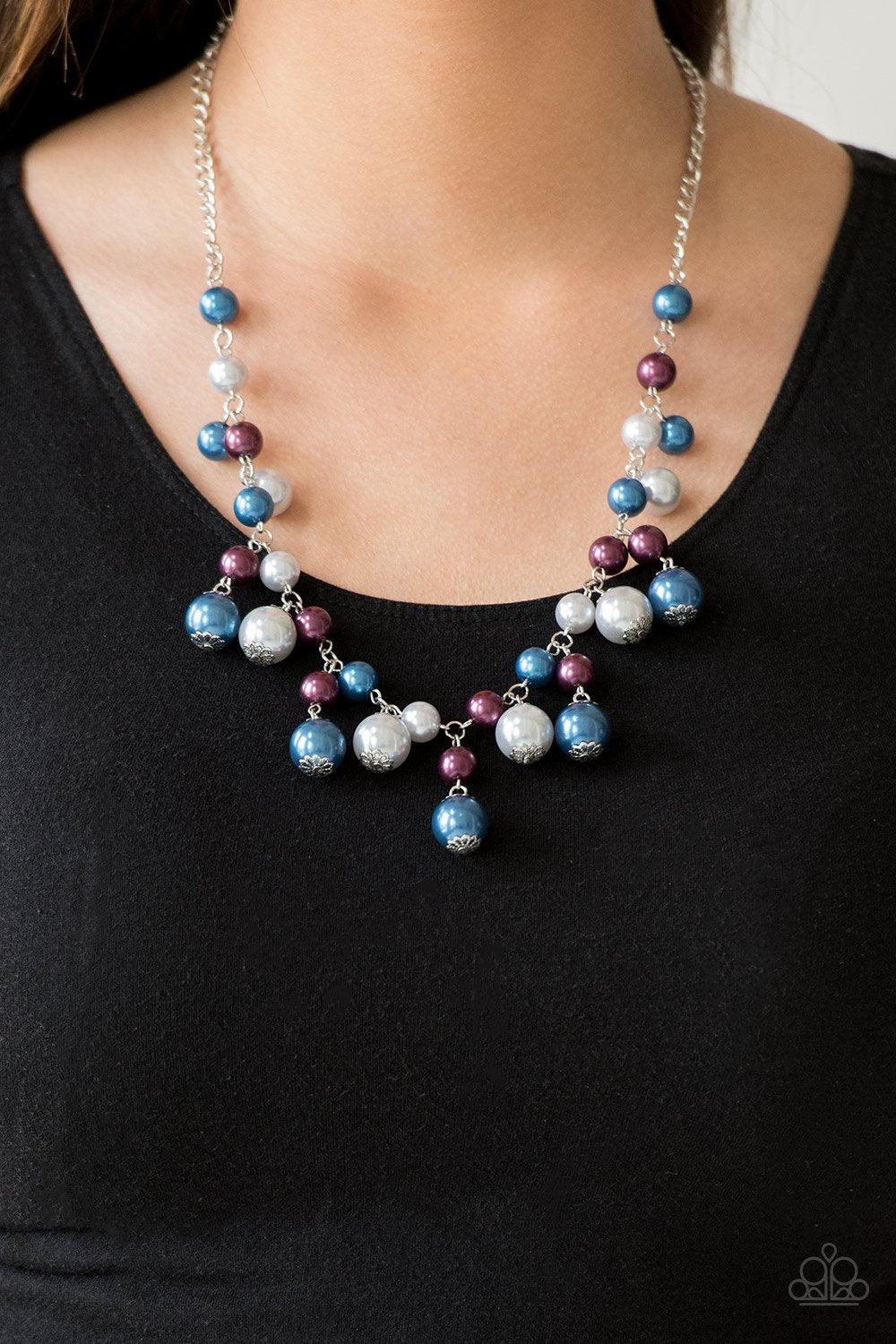 Paparazzi Accessories Soon To Be Mrs. - Multi Varying in size, bubbly blue, purple, and silver pearls swing from the bottom of a classic strand of pearls, creating a refined fringe below the collar. Features an adjustable clasp closure. Sold as one indivi