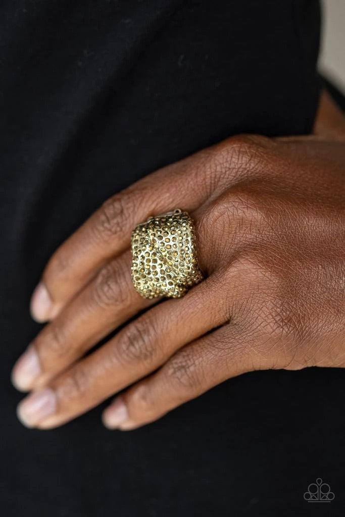 Paparazzi Accessories Imperial Industrialism - Brass Encrusted in row after row of golden aurum rhinestones, warped brass bands coalesce into a single sparkling frame across the finger for an edgy look. Features a stretchy band for a flexible fit. Sold as