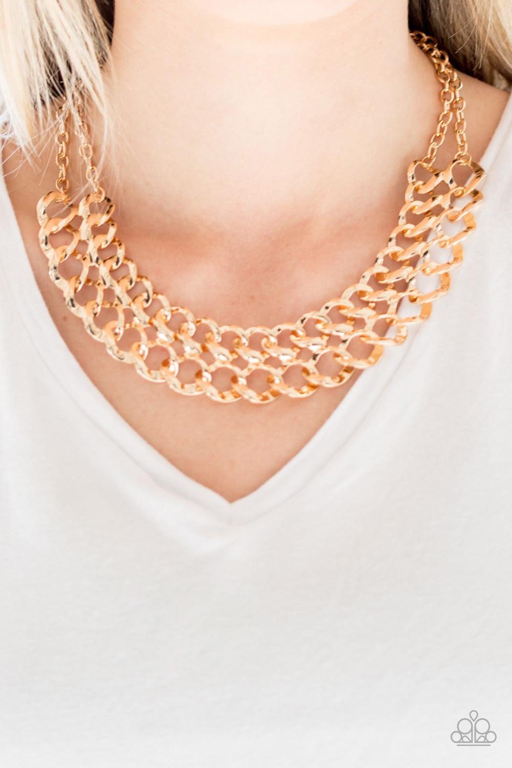 Paparazzi Accessories Street Meet And Greet - Gold Asymmetrical gold frames connect below the collar, creating a bold web-like fringe for a statement-making look. Features an adjustable clasp closure. Jewelry
