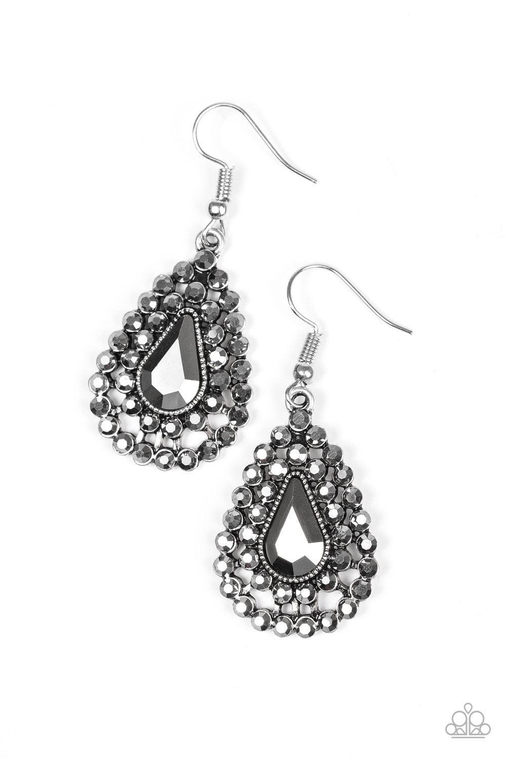 Paparazzi Accessories Diamond Dazzle - Silver Glittery hematite rhinestones spin around a teardrop gem, coalescing into a dazzling lure. Earring attaches to a standard fishhook fitting. Jewelry