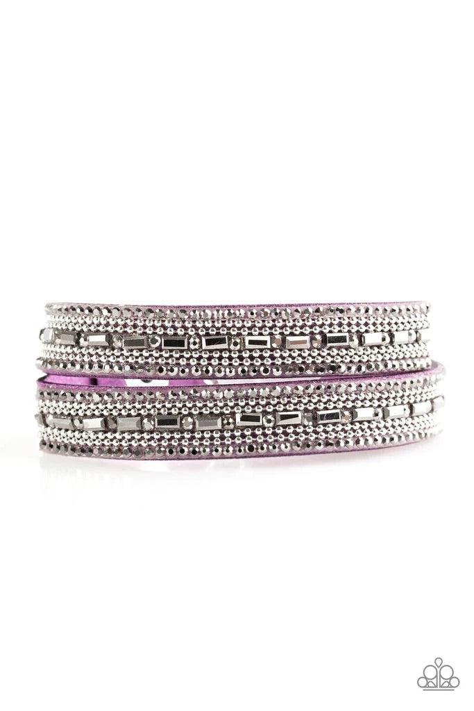 Paparazzi Accessories Shimmer And Sass - Purple Featuring round and emerald style cuts, glassy hematite rhinestones are encrusted along a purple suede band. Rows of shimmery silver ball-chain are pressed into the glittery band for a sassy finish. The elon