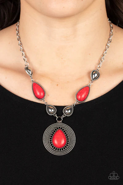 Paparazzi Accessories Saguaro Soul Trek - Red Bordered in studded and spun silver textures, shiny silver teardrops alternate with red stone frames at the bottom of a silver chain. Bordered in whirls of studded details, an oversized red teardrop stone is p