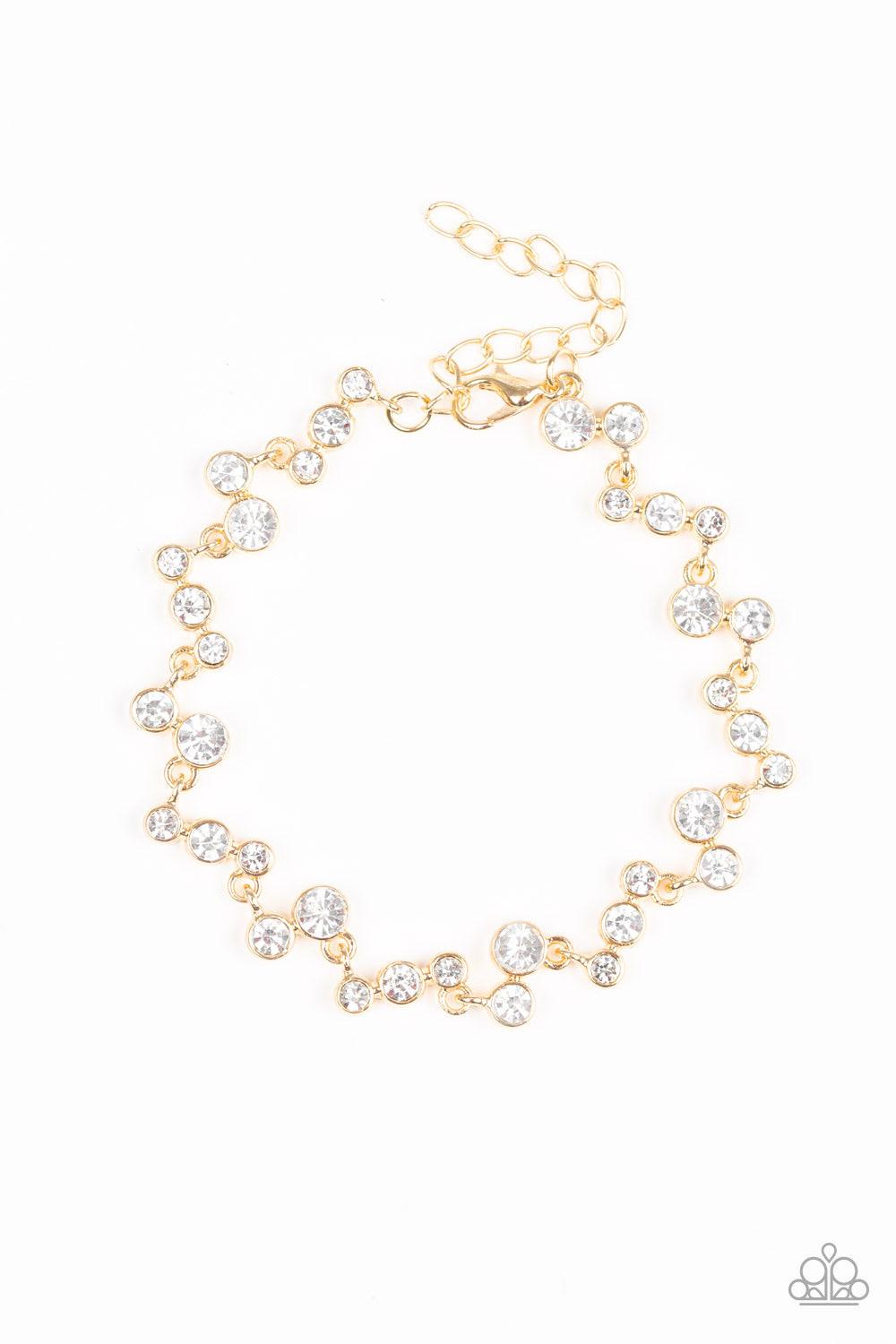 Paparazzi Accessories Starlit Stunner - Gold Encased in sleek gold fittings, mismatched white rhinestone encrusted frames link across the wrist in a timeless fashion. Features an adjustable clasp closure. Jewelry
