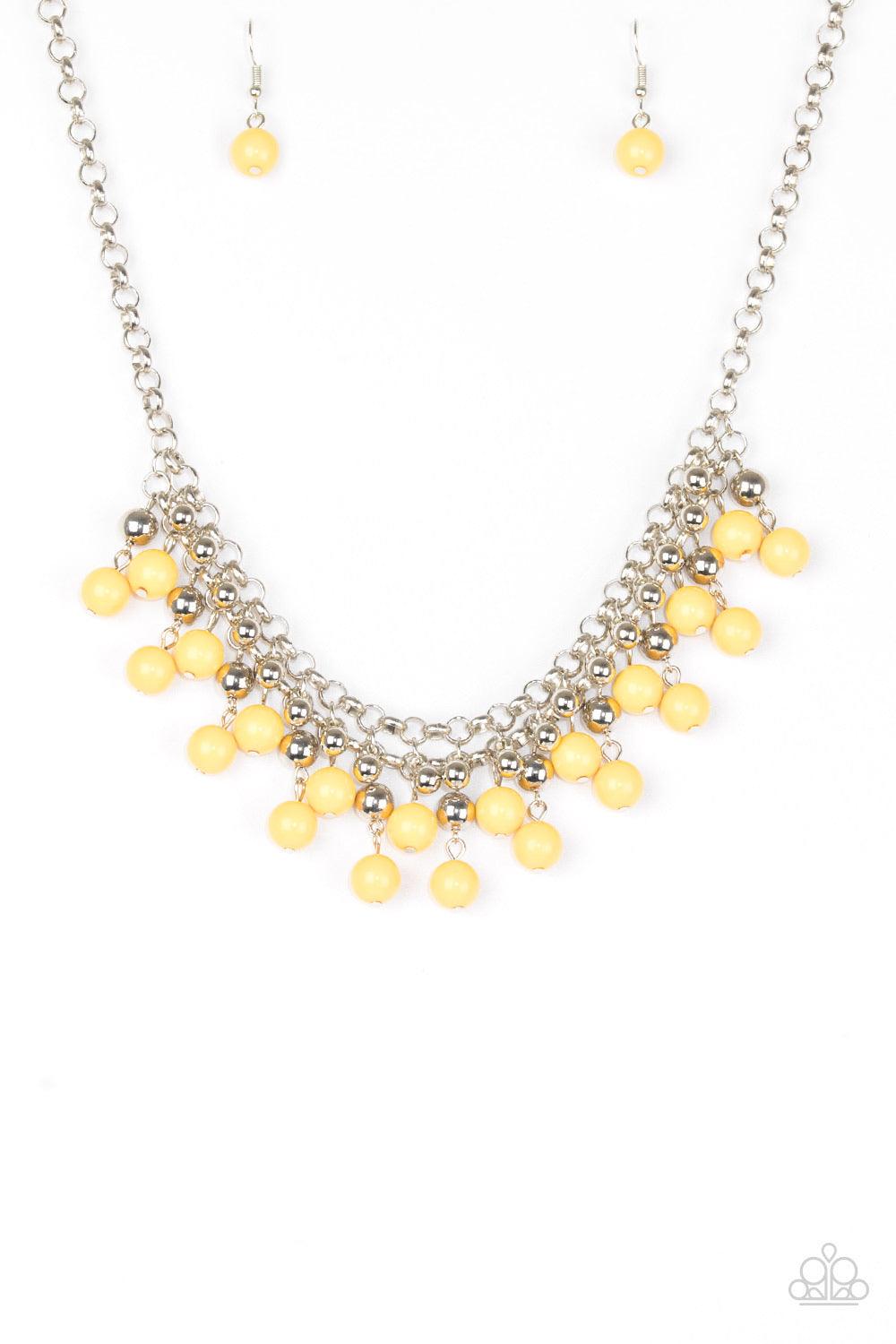Paparazzi Accessories Friday Night Fringe - Yellow Rows of classic silver and sunny yellow beads trickle from two rows of interlocking silver chains, creating a bold colorful fringe below the collar. Features and adjustable clasp closure. Sold as one indi