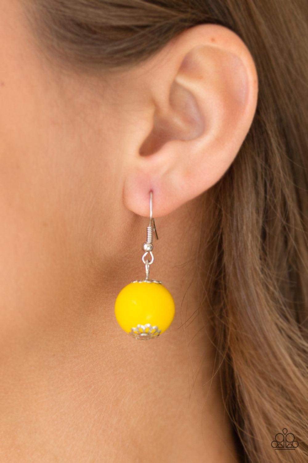 Paparazzi Accessories Summer Breezin - Yellow A variety of yellow wooden beads are threaded along a brown string draped across the chest for a summery flair. Jewelry